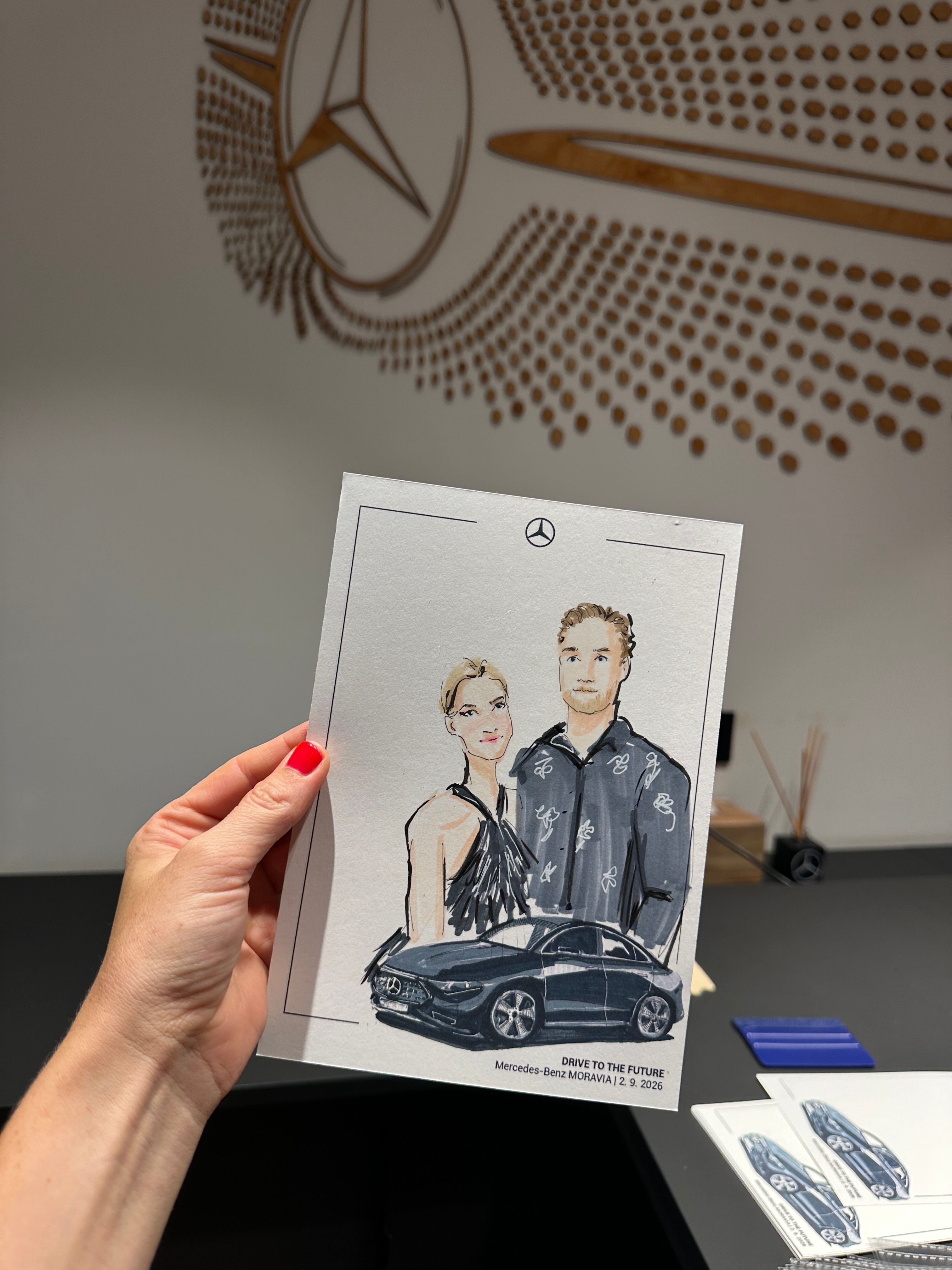 Personalized fashion illustration of couple with a Mercedes-Benz vehicle, created during live sketching in Olomouc.